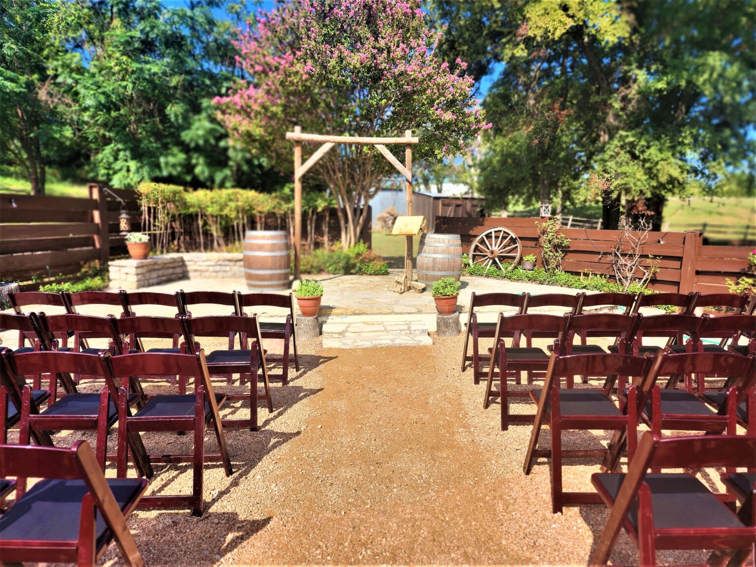 Ceremony chairs arranged outside at Chisholm Trail Rustic Venue