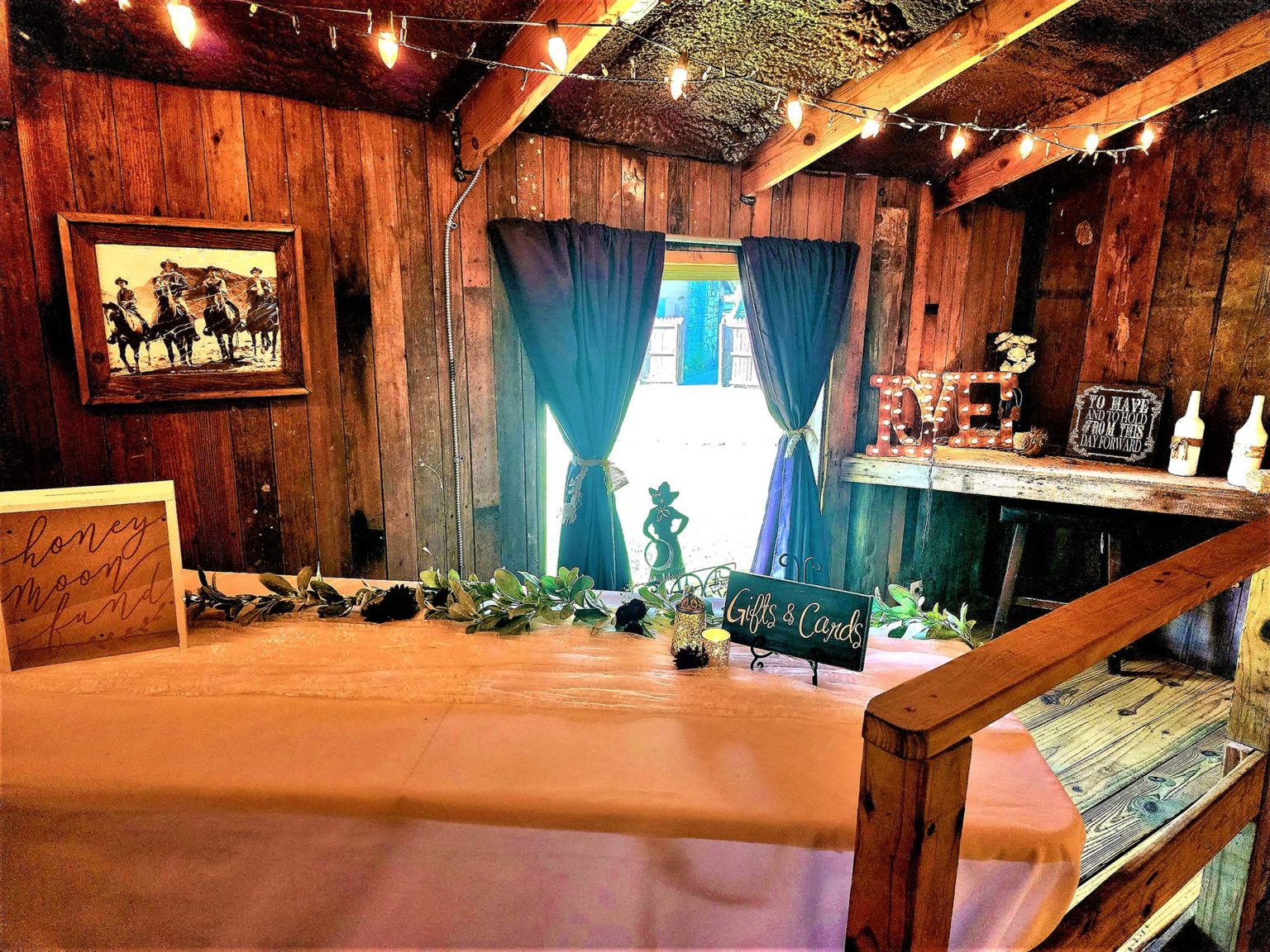 Gift table and event details inside the barn