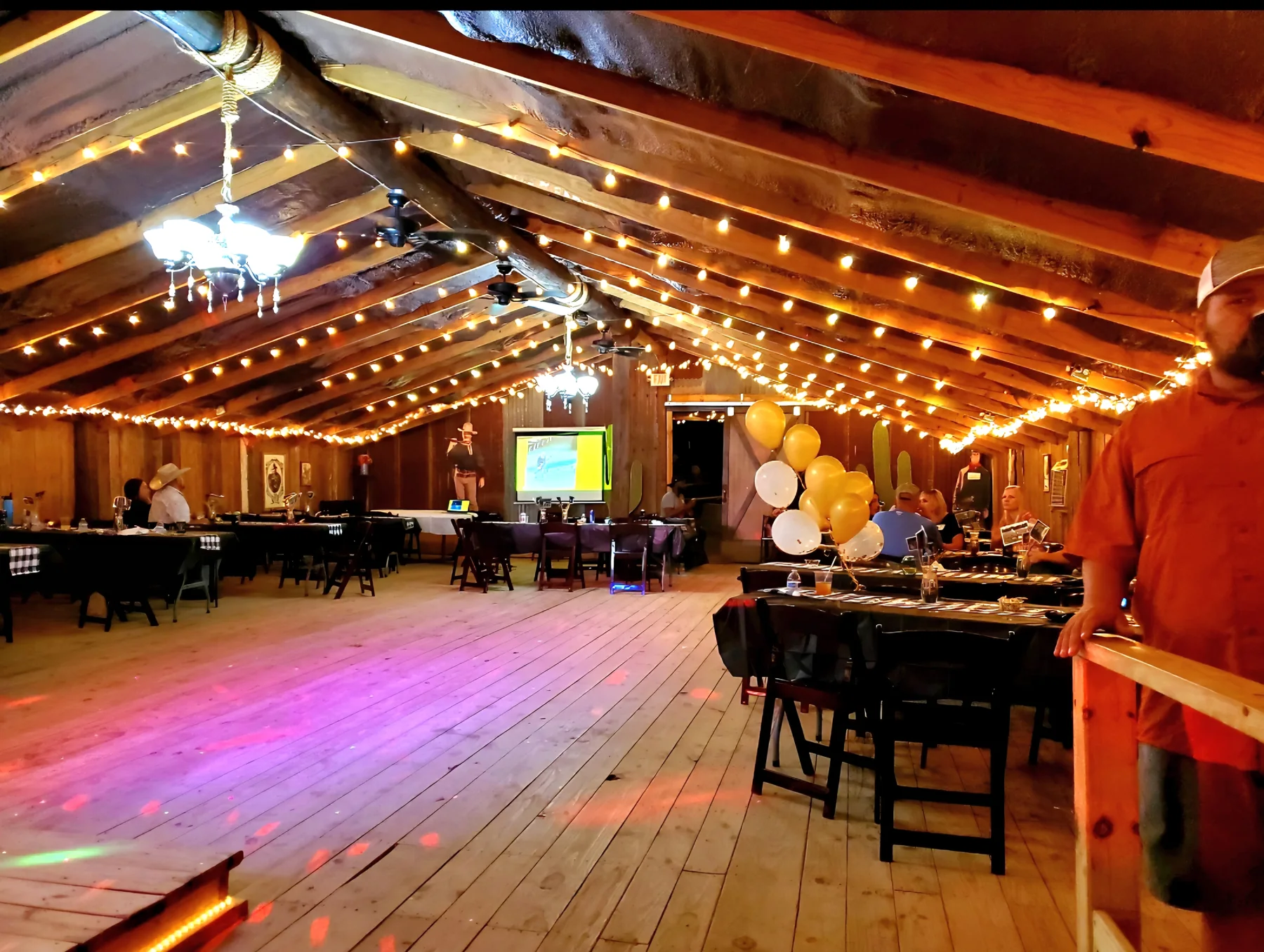 Barn dance floor and reception setup at Chisholm Trail Rustic Venue