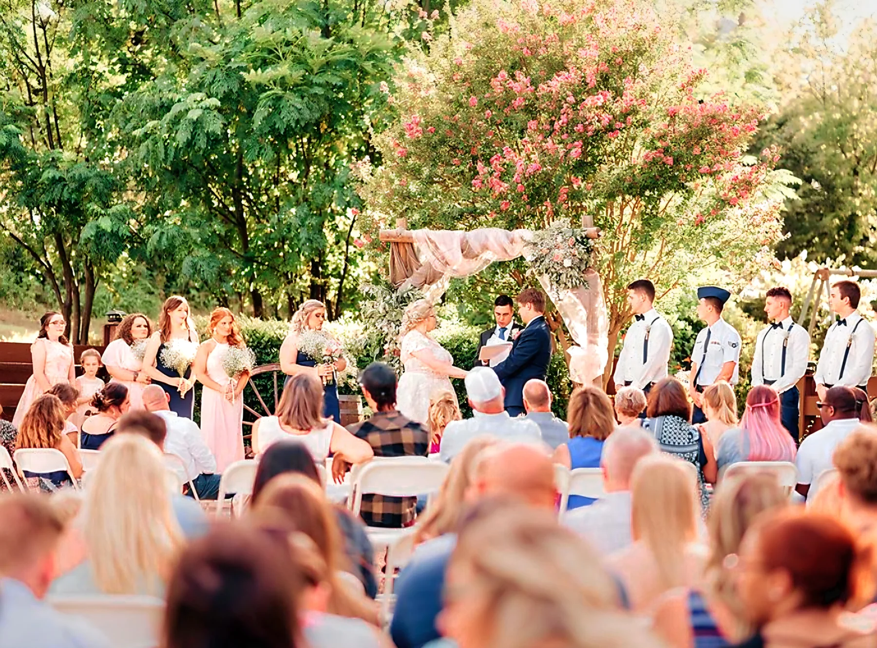 Outdoor wedding ceremony with guests at Chisholm Trail Rustic Venue