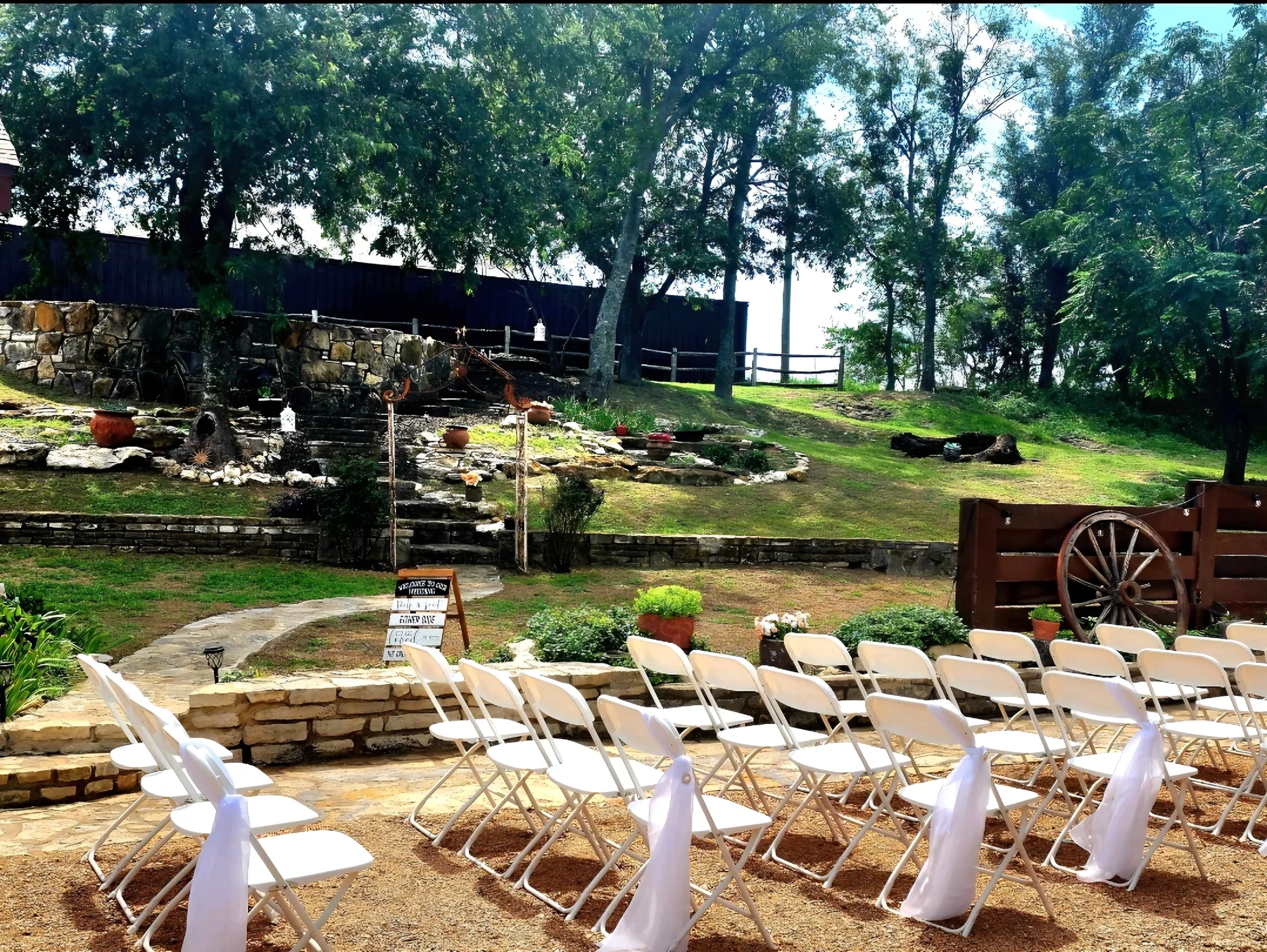 Outdoor courtyard ceremony setup at Chisholm Trail Rustic Venue