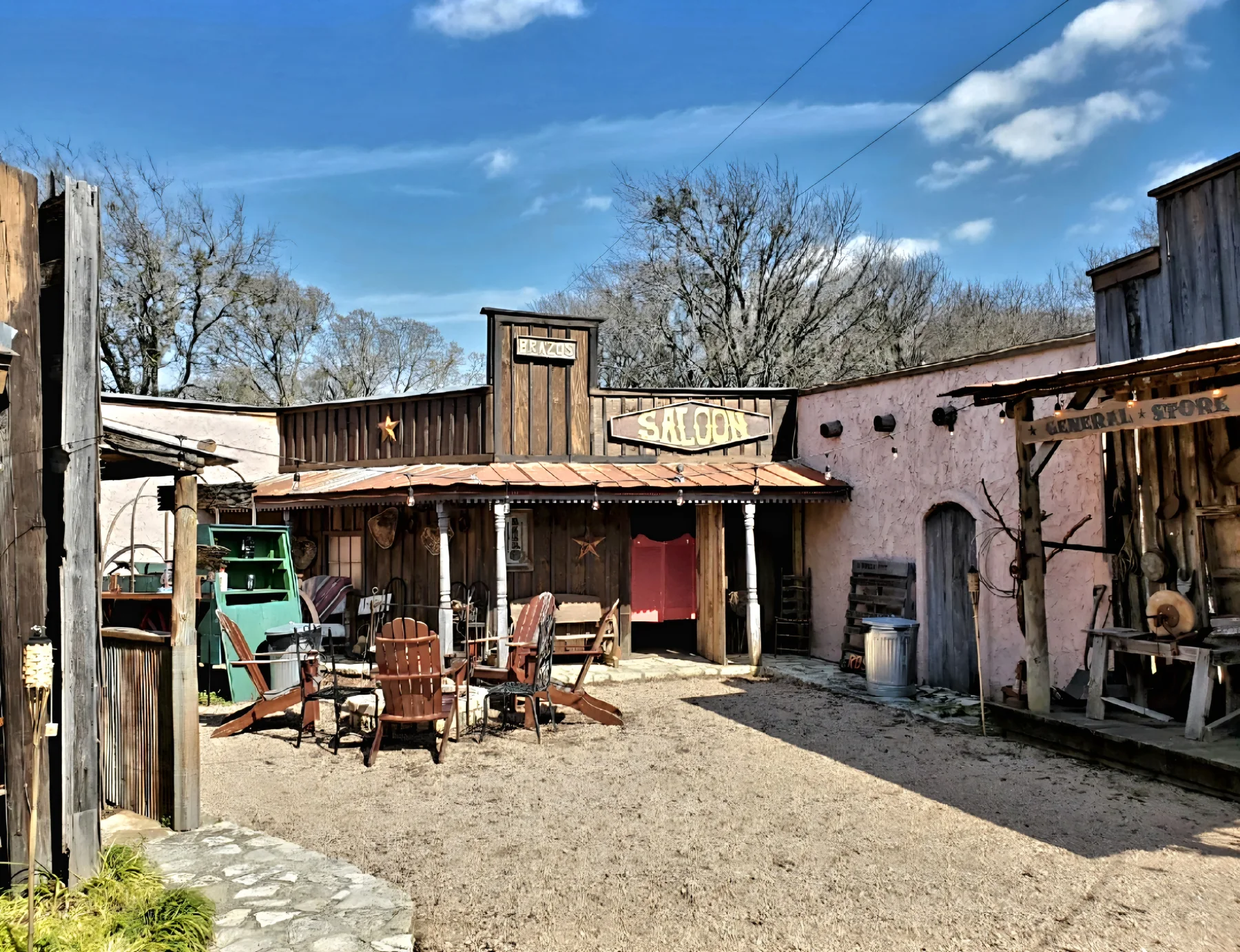 Western town courtyard and saloon storefront at Chisholm Trail Rustic Venue